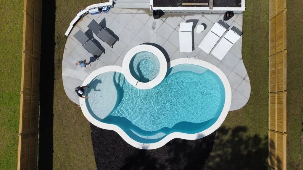 A picture of a beautiful oblong-shaped gunite pool