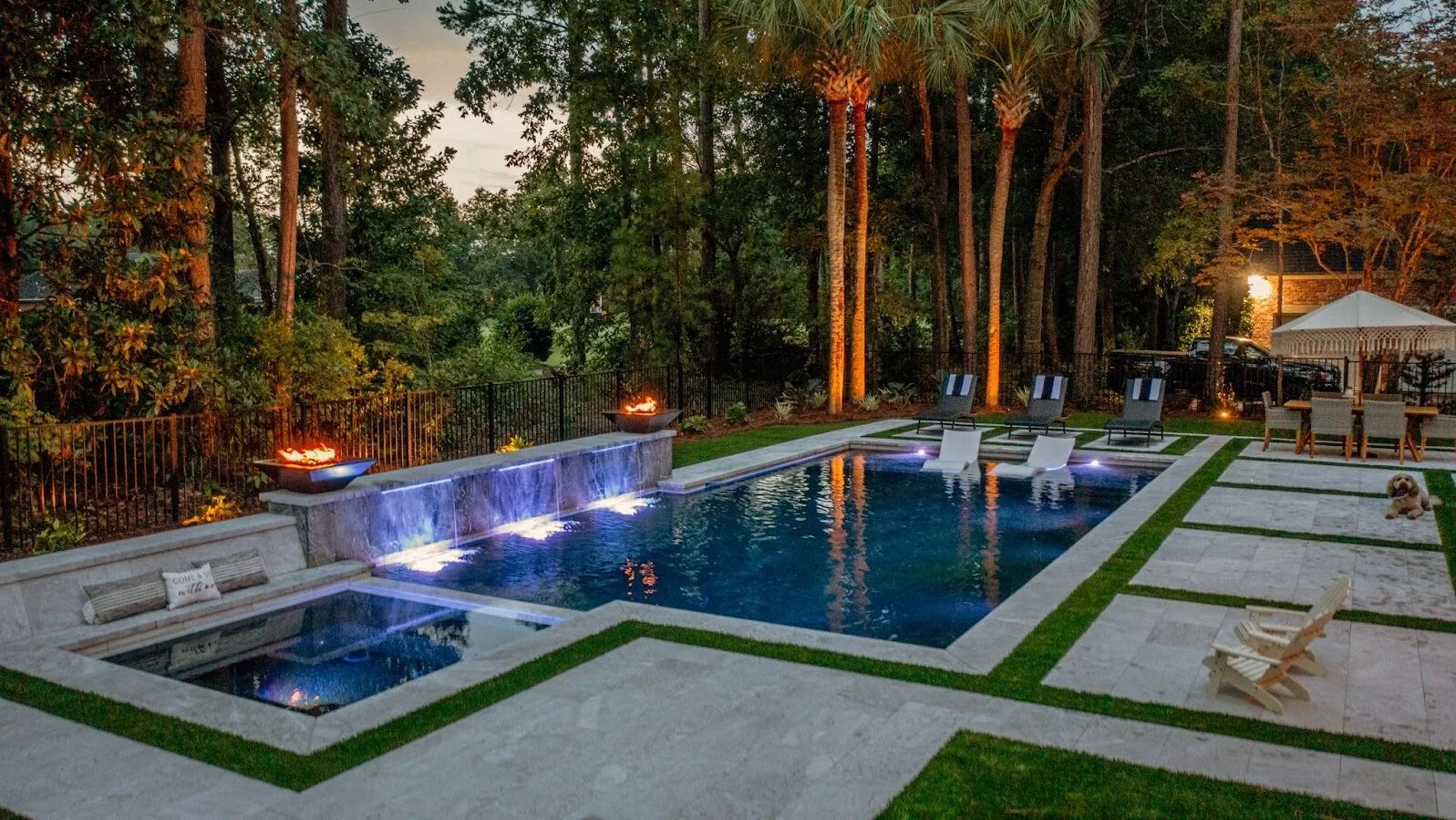Luxury backyard pool with clean lines, spacious patio, and modern outdoor living design.