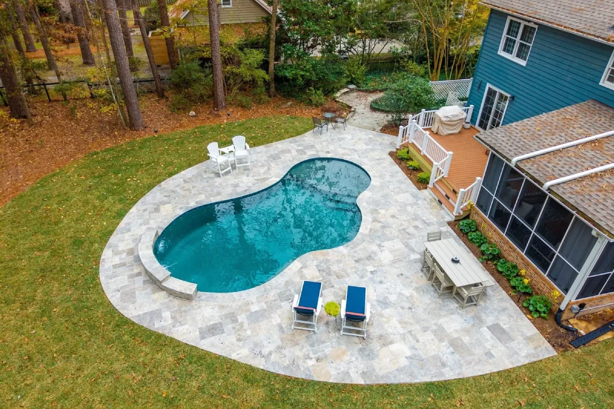 Custom backyard pool showcasing durable gunite construction and design detail