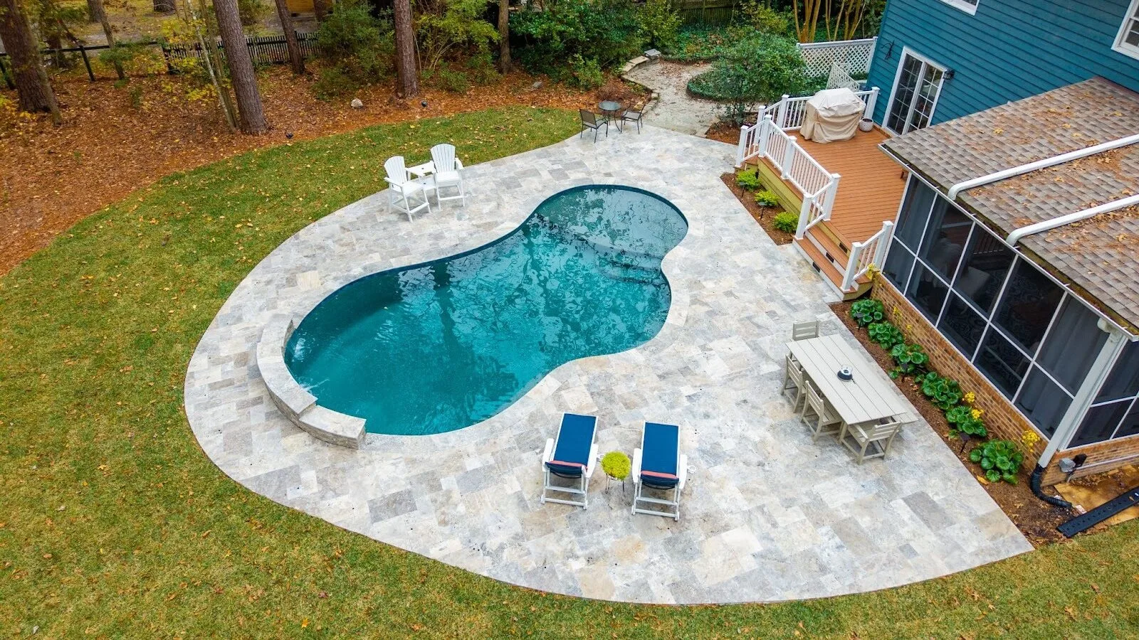 Custom backyard pool showcasing durable gunite construction and design detail