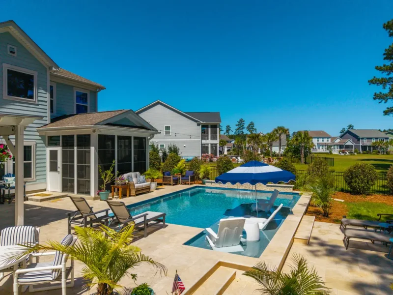 A large outdoor backyard pool