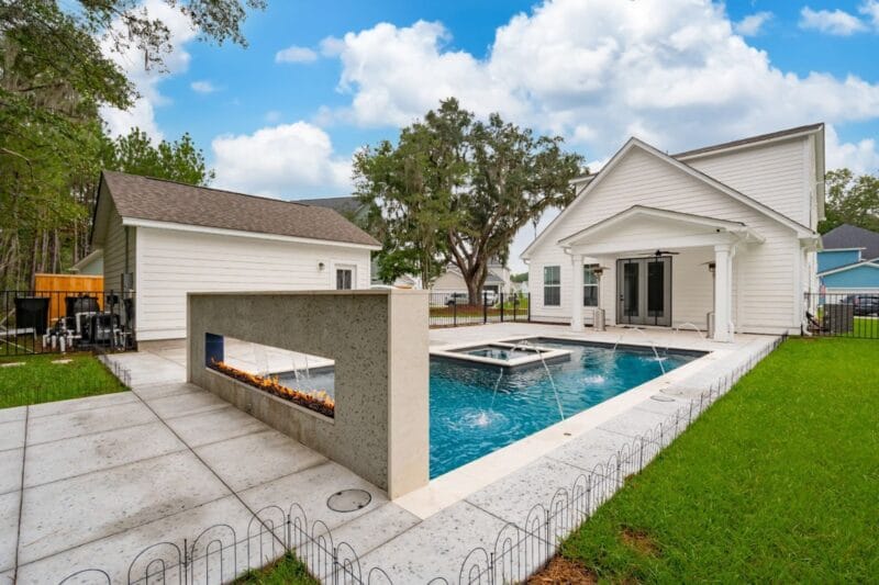 A white backyard gunite pool
