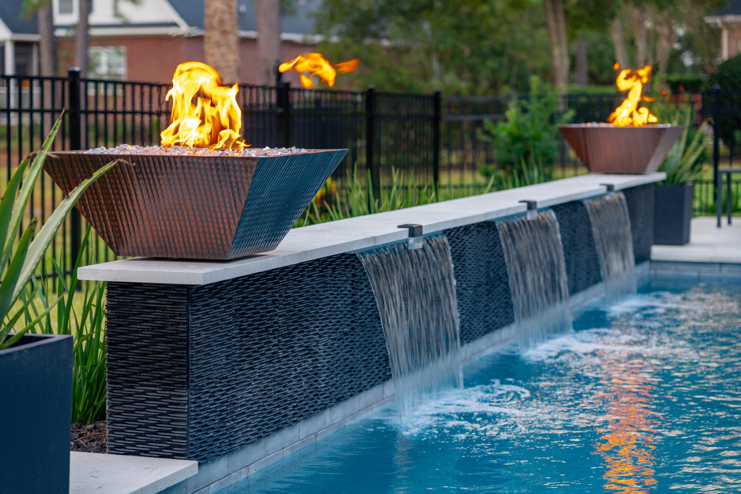 Fairwaywoods Drive Fire bowls and waterfall on a gunite pool