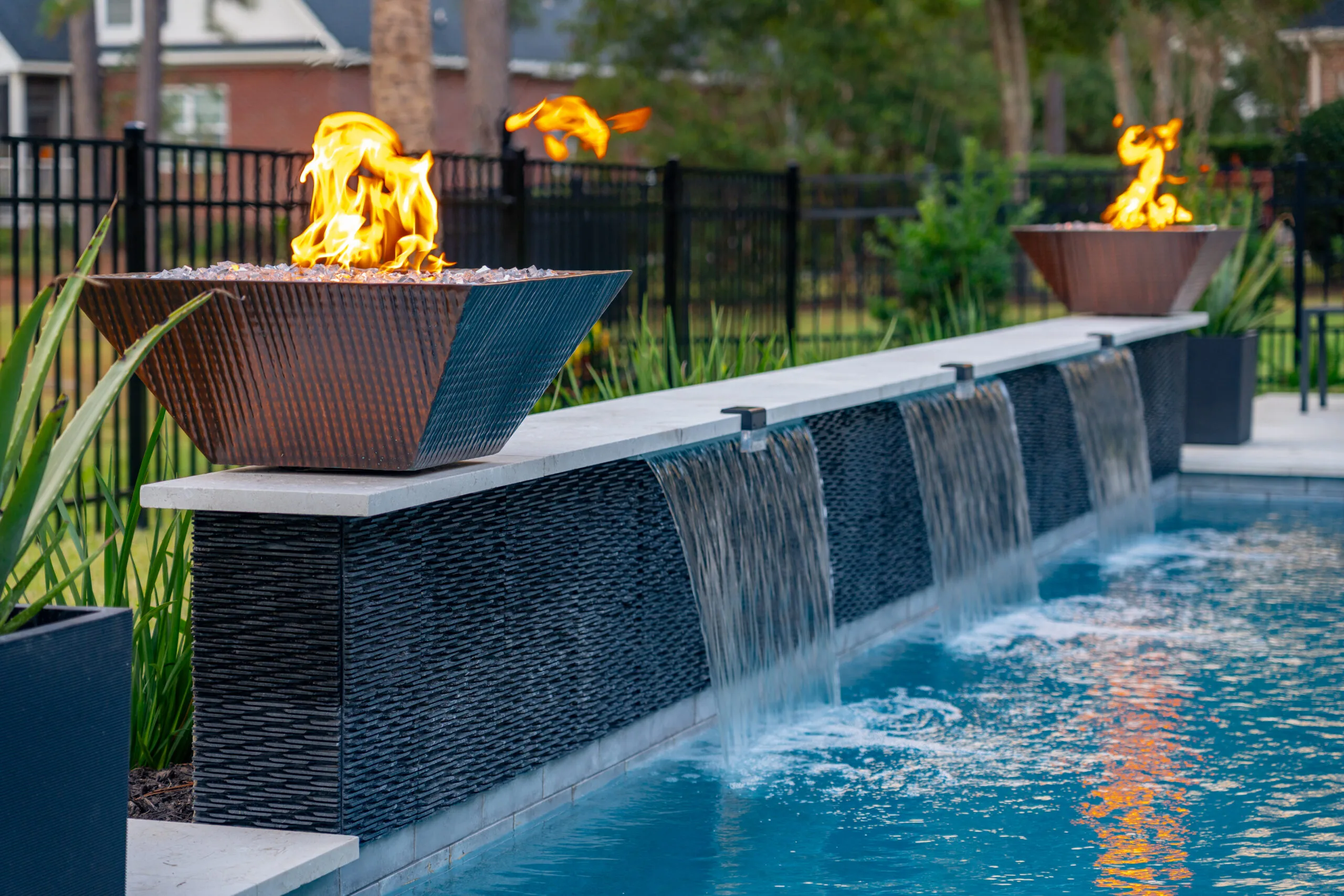 Fairwaywoods Drive Fire bowls and waterfall on a gunite pool