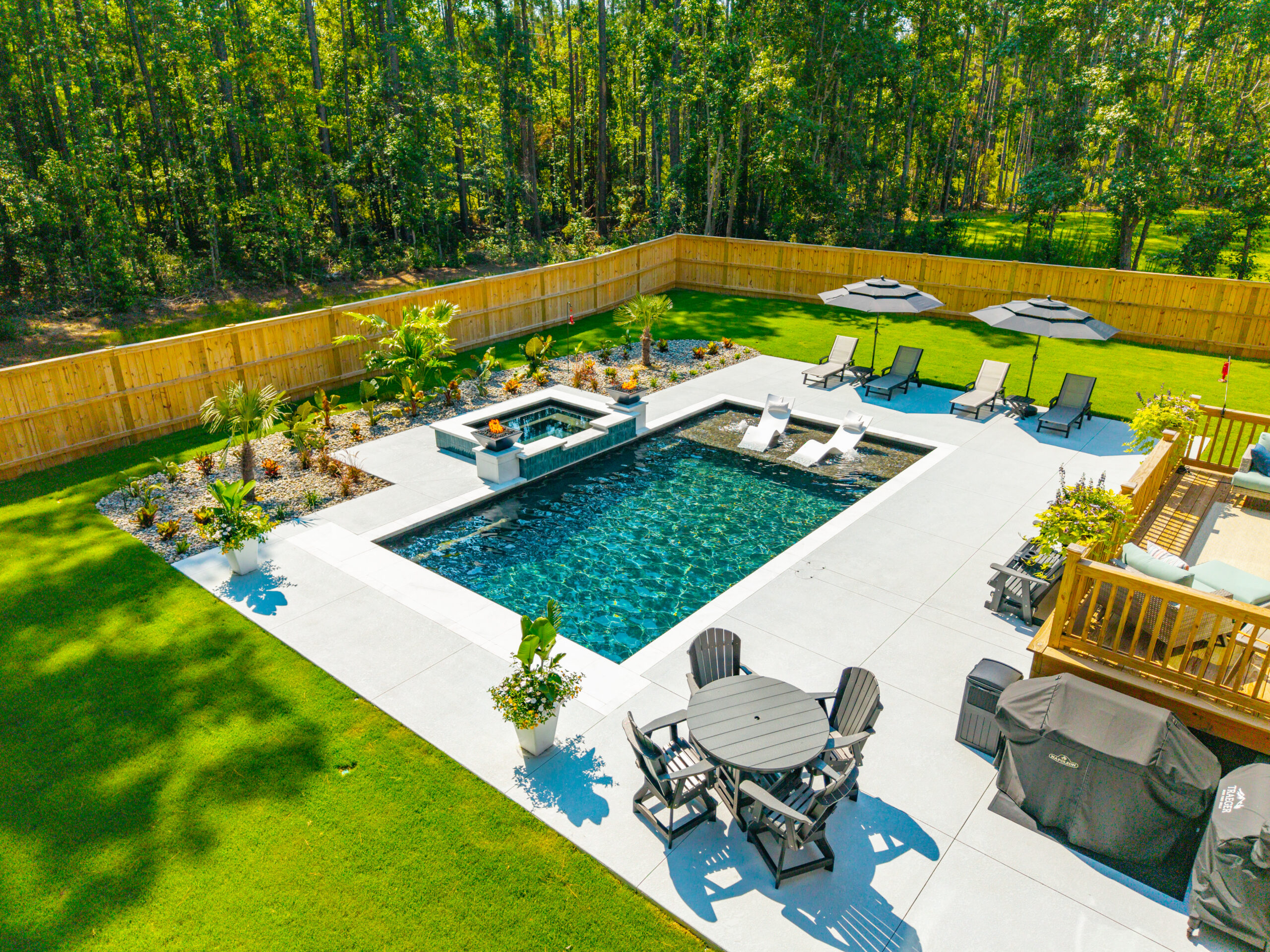 A Hogan gunite pool built in a backyard by a swimming pool builder in South Carolina