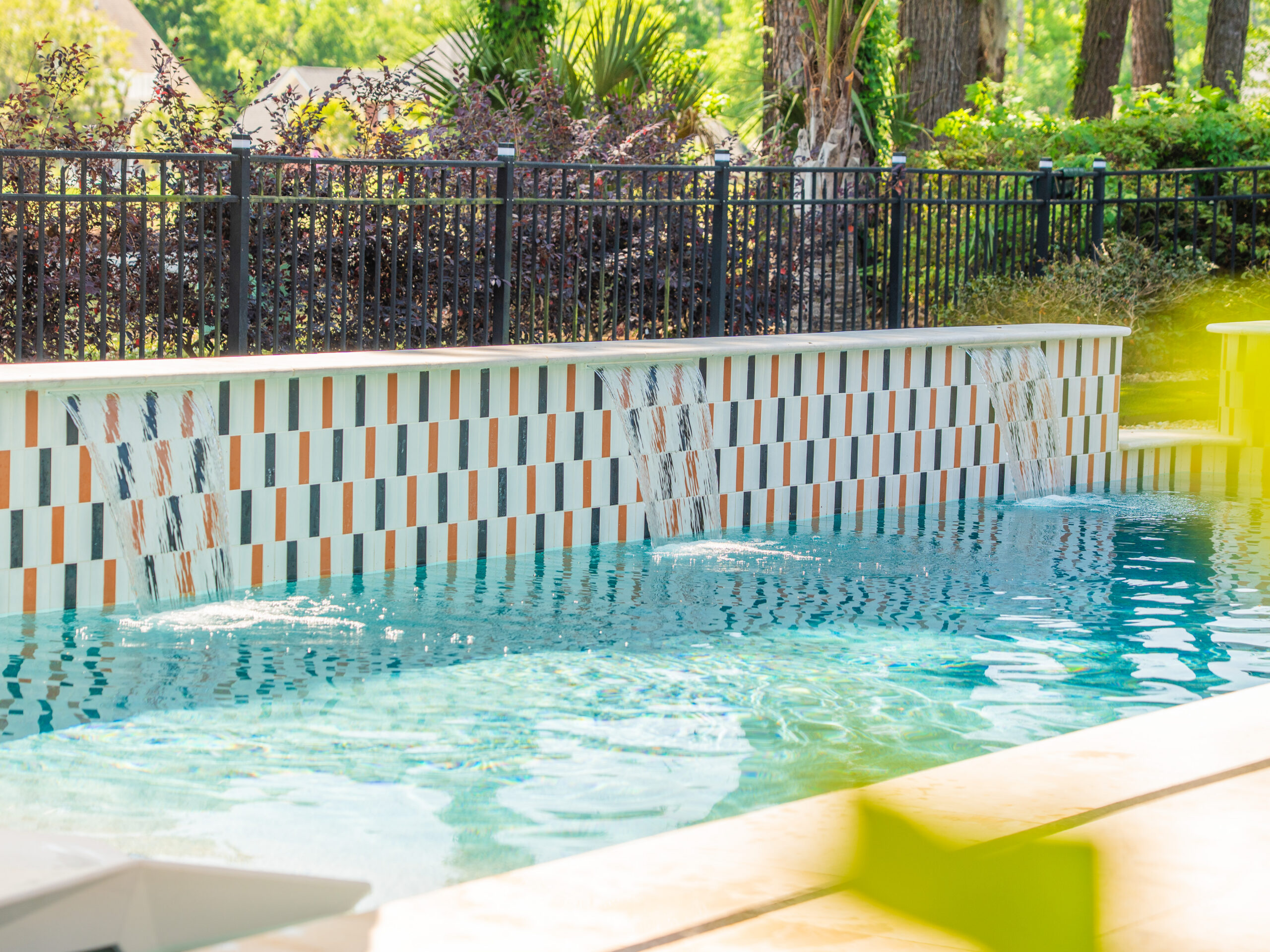 Spotted pool waterfall on a gunite pool
