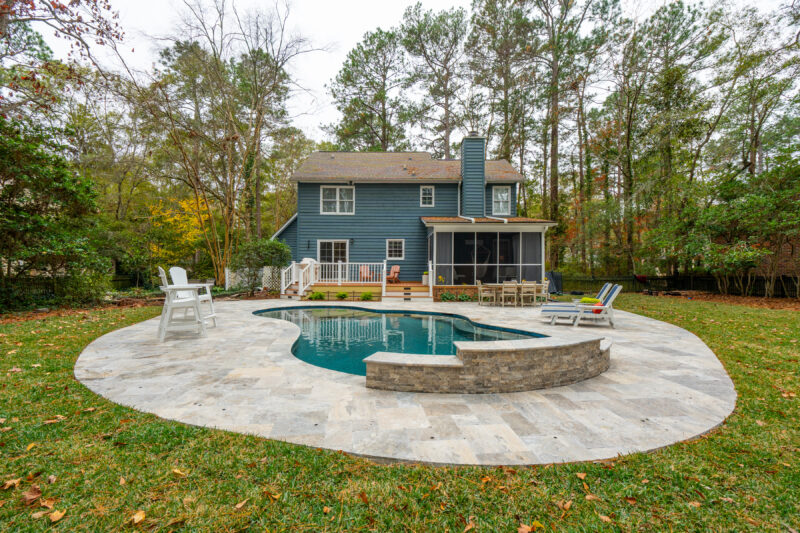 A circular backyard gunite pool