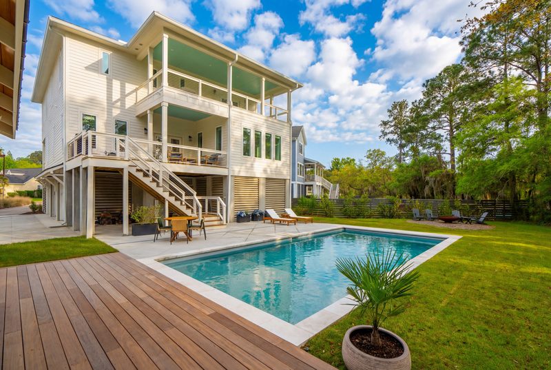 A wood and grass-decked gunite pool